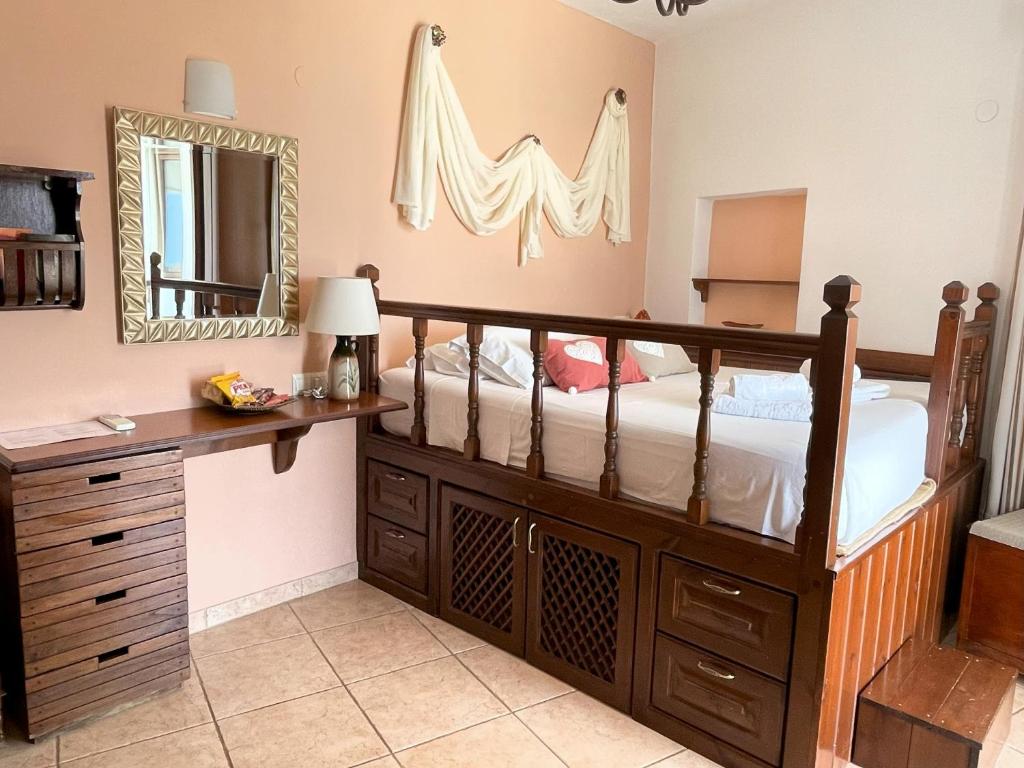 Łóżko lub łóżka w pokoju w obiekcie Nikelen Lindian Exclusive Apartments