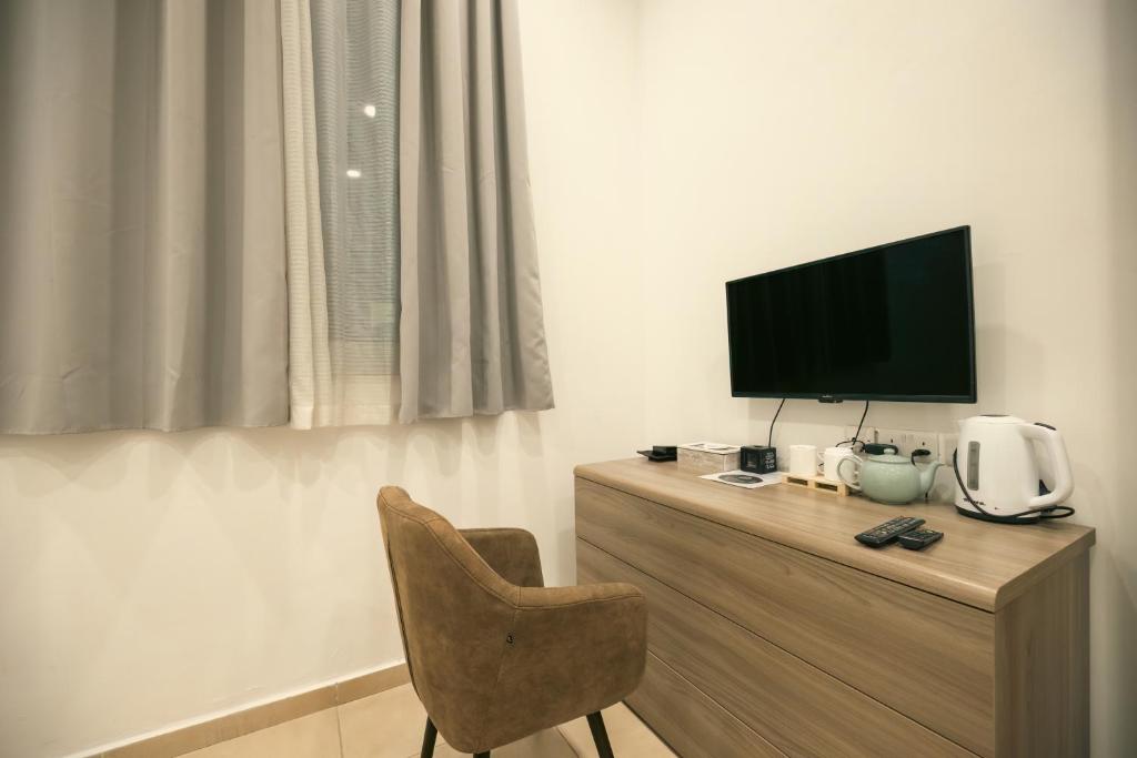 Příslušenství pro přípravu čaje a kávy v ubytování Sliema Central O'Clock Malta