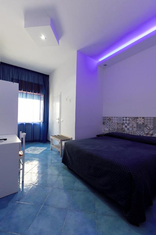 Postel nebo postele na pokoji v ubytování B&B Villa Passiaturo