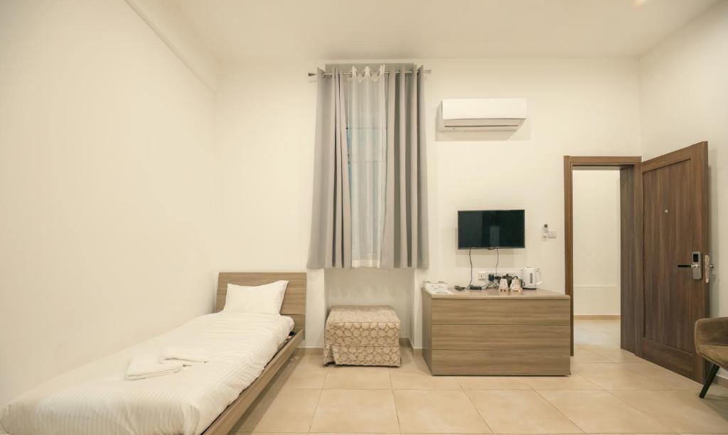 TV a/nebo společenská místnost v ubytování Sliema Central O'Clock Malta