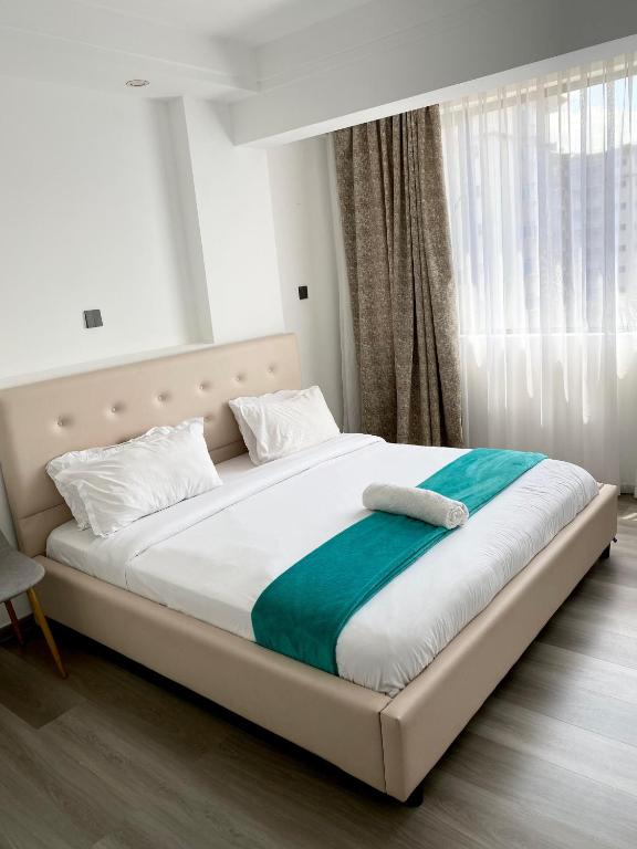 Ένα ή περισσότερα κρεβάτια σε δωμάτιο στο City Oasis, 1 Bedroom