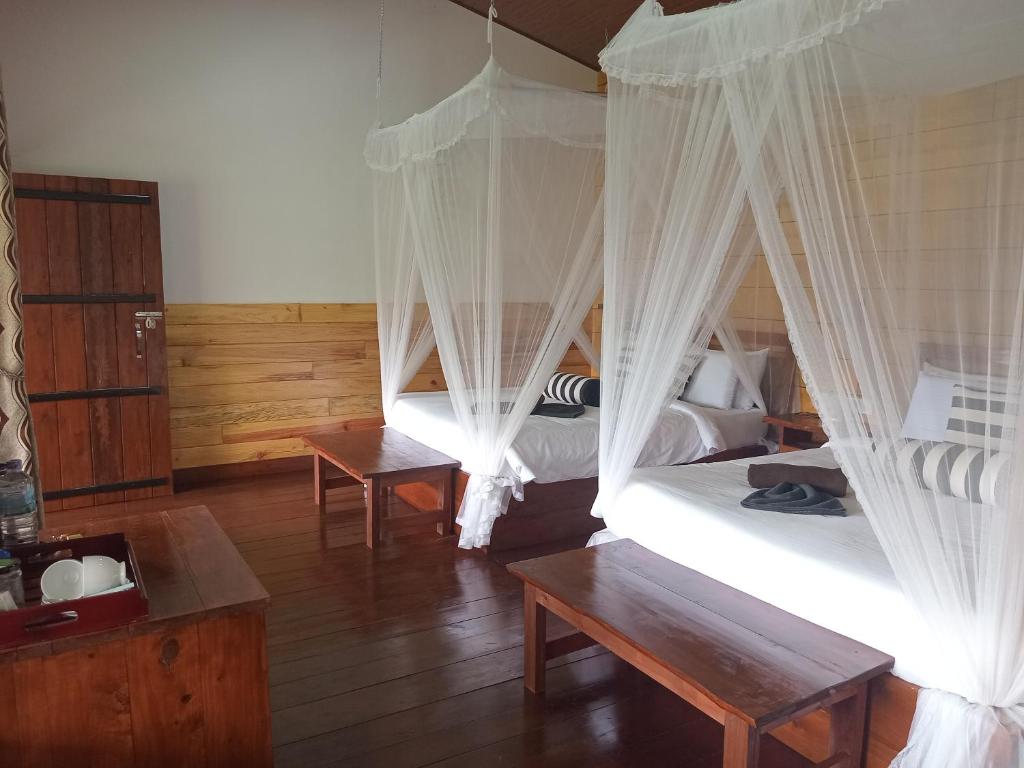 Postel nebo postele na pokoji v ubytování NETHSARA cottage