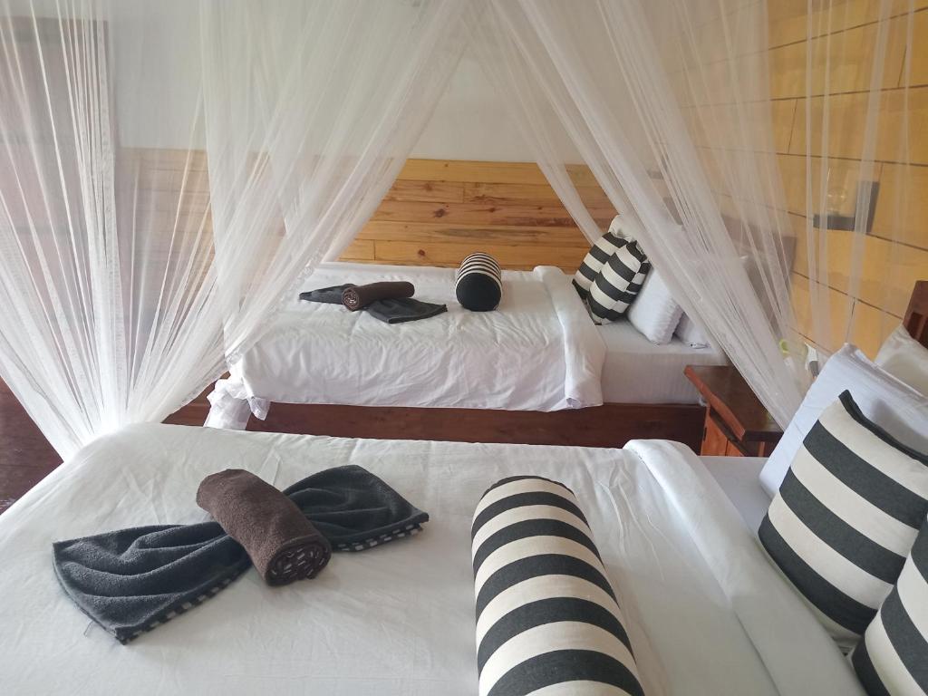 Postel nebo postele na pokoji v ubytování NETHSARA cottage