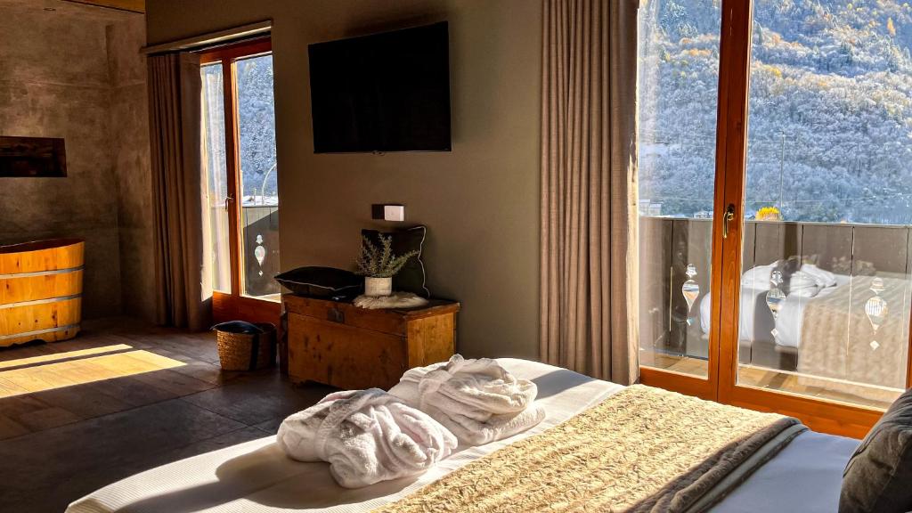 Postel nebo postele na pokoji v ubytování Agarthi Suites - Valtellina