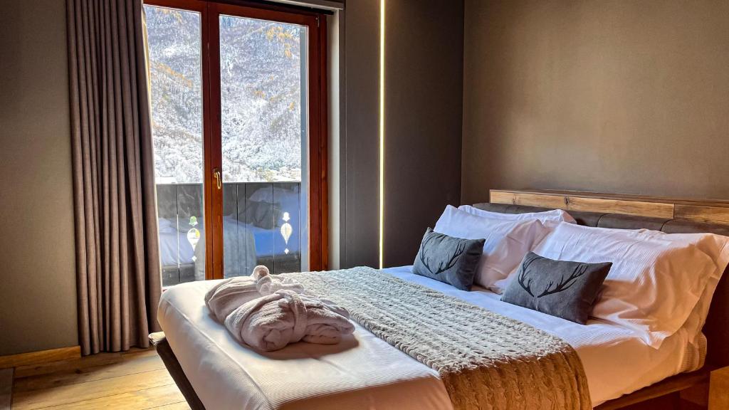 Postel nebo postele na pokoji v ubytování Agarthi Suites - Valtellina