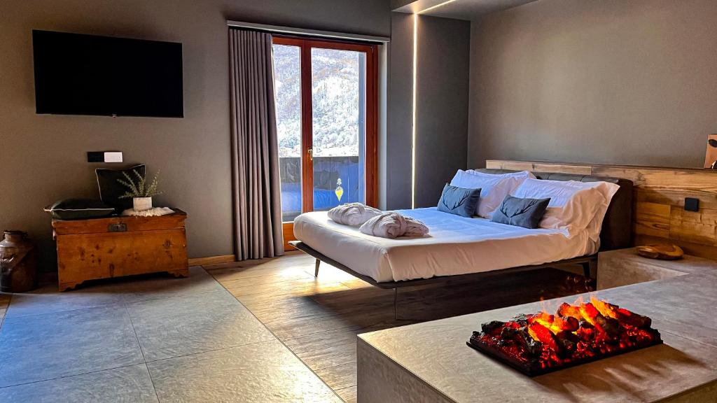 Postel nebo postele na pokoji v ubytování Agarthi Suites - Valtellina