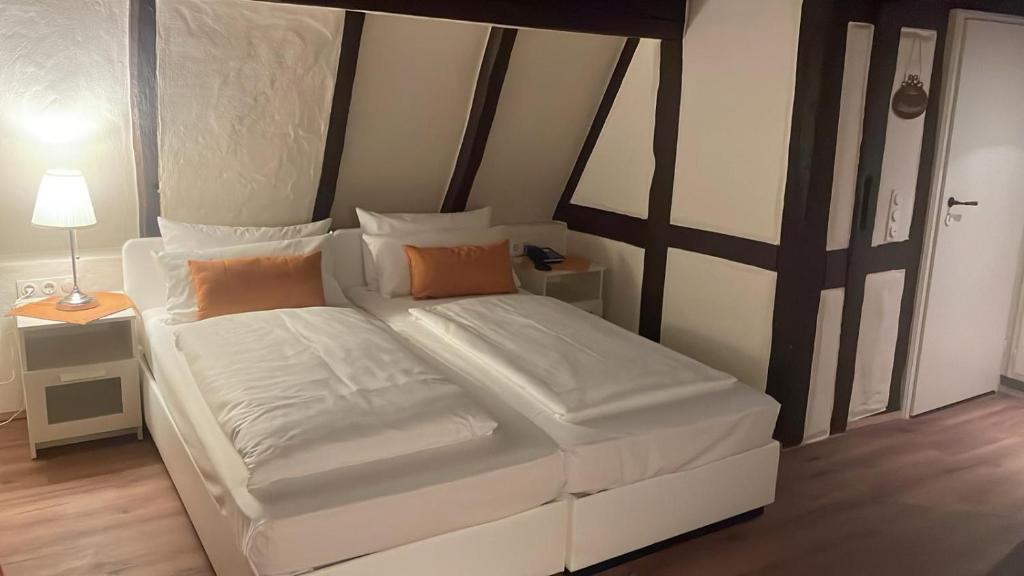 Postel nebo postele na pokoji v ubytování Hotel Restaurant Altes Badhaus