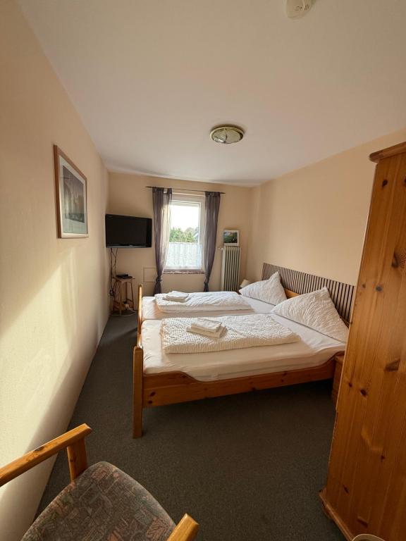 Postel nebo postele na pokoji v ubytování Hotel Mühleneck