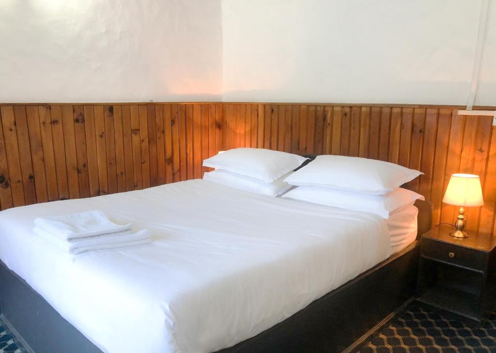 Postel nebo postele na pokoji v ubytování Xanadu Homes