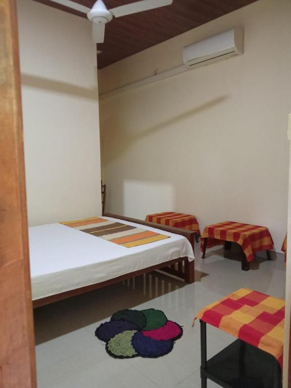 Postel nebo postele na pokoji v ubytování Udesh Guest