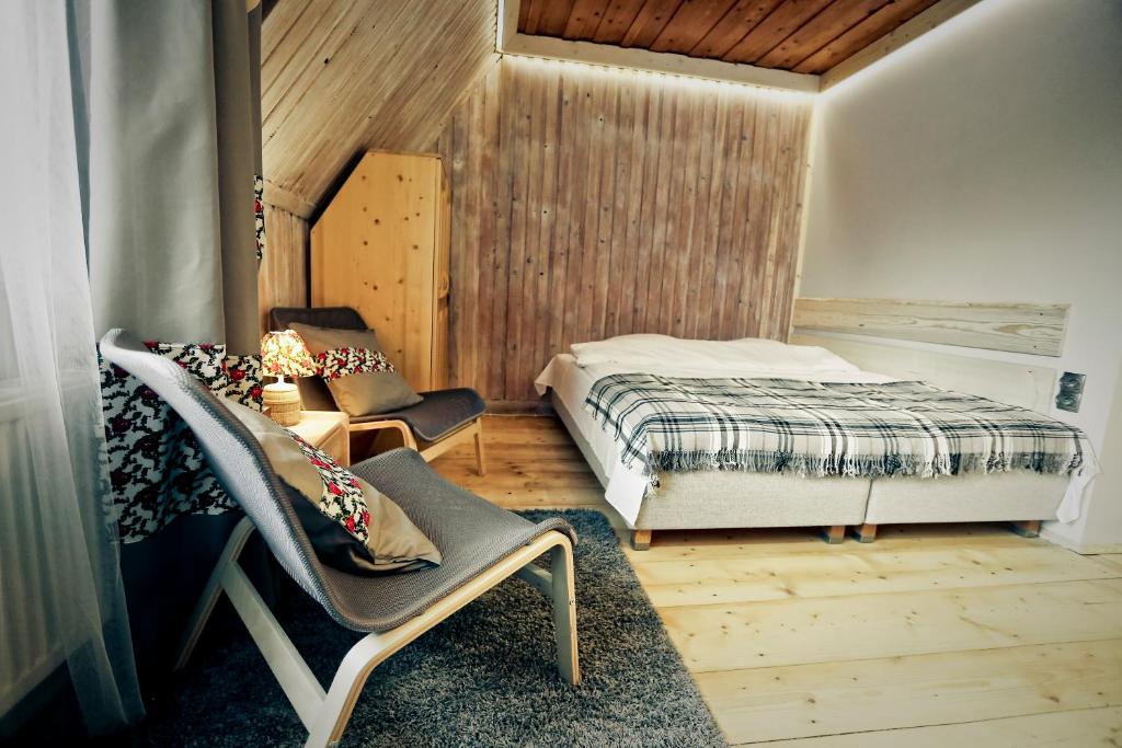 Posteľ alebo postele v izbe v ubytovaní Nosalove Apartamenty