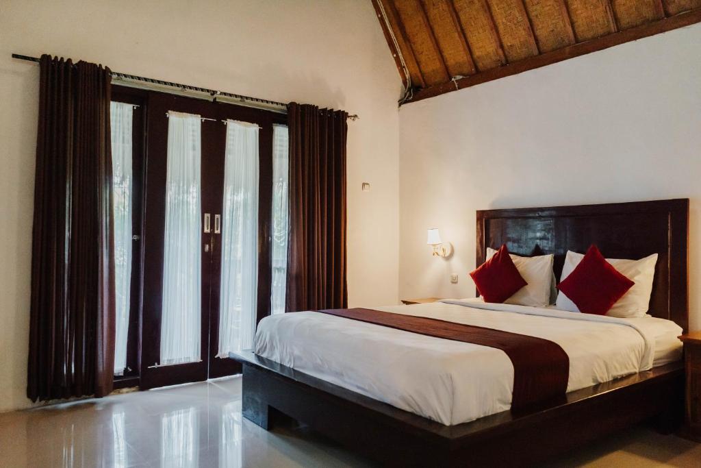 Postel nebo postele na pokoji v ubytování Temeling Jungle Inn