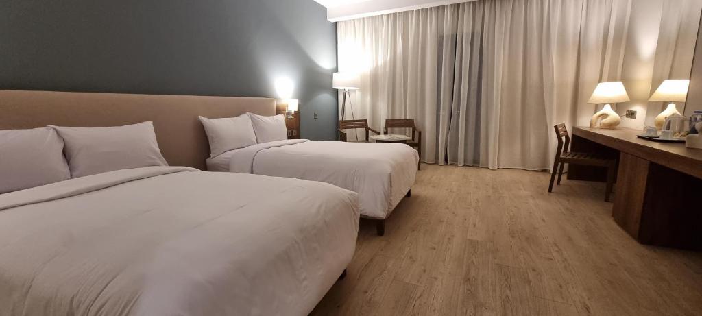 Postel nebo postele na pokoji v ubytování Phoenix Hotel & Wellness