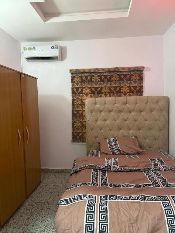 Postel nebo postele na pokoji v ubytování Mercy Apartment