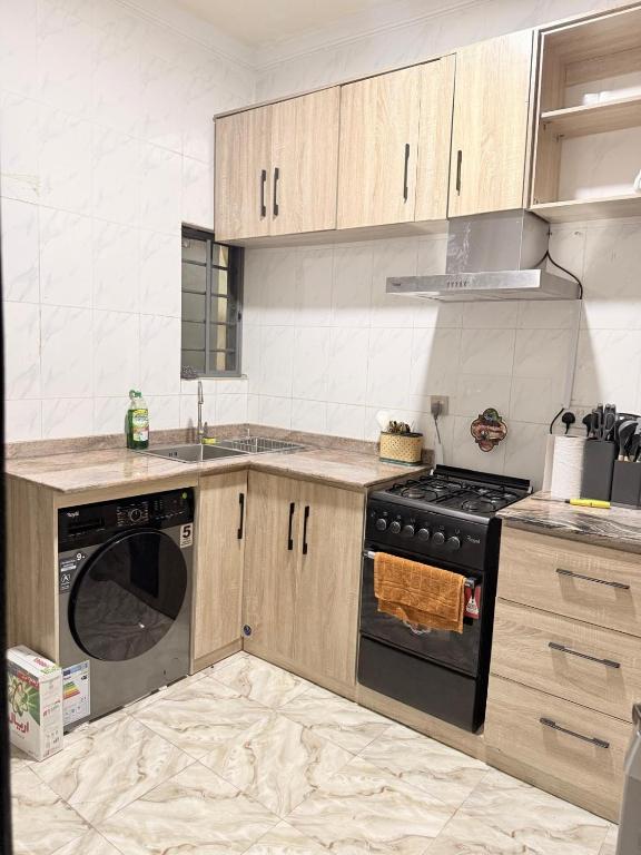 Kuchyň nebo kuchyňský kout v ubytování Mercy Apartment