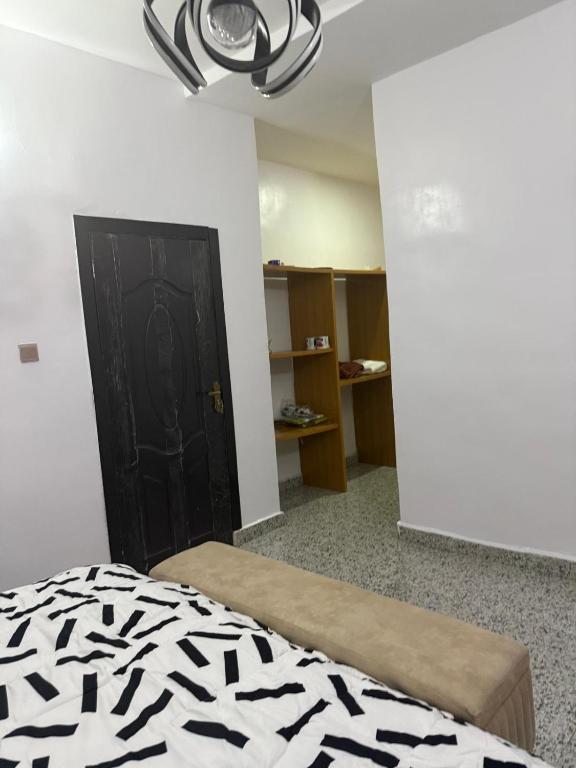 Postel nebo postele na pokoji v ubytování Mercy Apartment