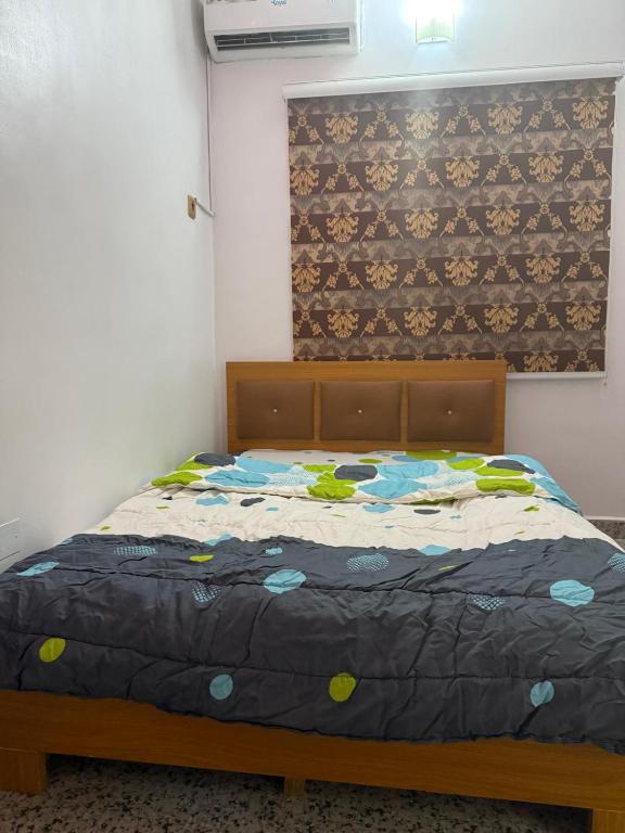 Postel nebo postele na pokoji v ubytování Mercy Apartment