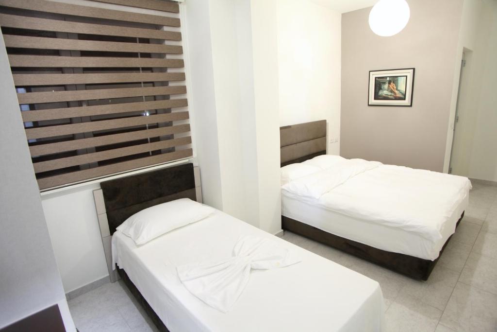 Postel nebo postele na pokoji v ubytování Fjortes Hotel