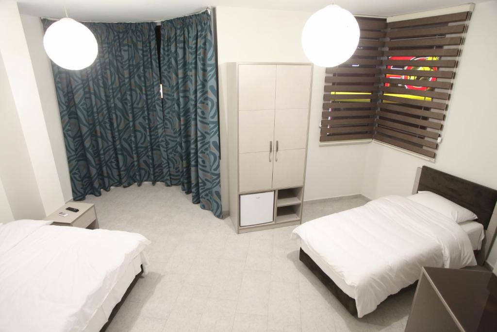 Postel nebo postele na pokoji v ubytování Fjortes Hotel