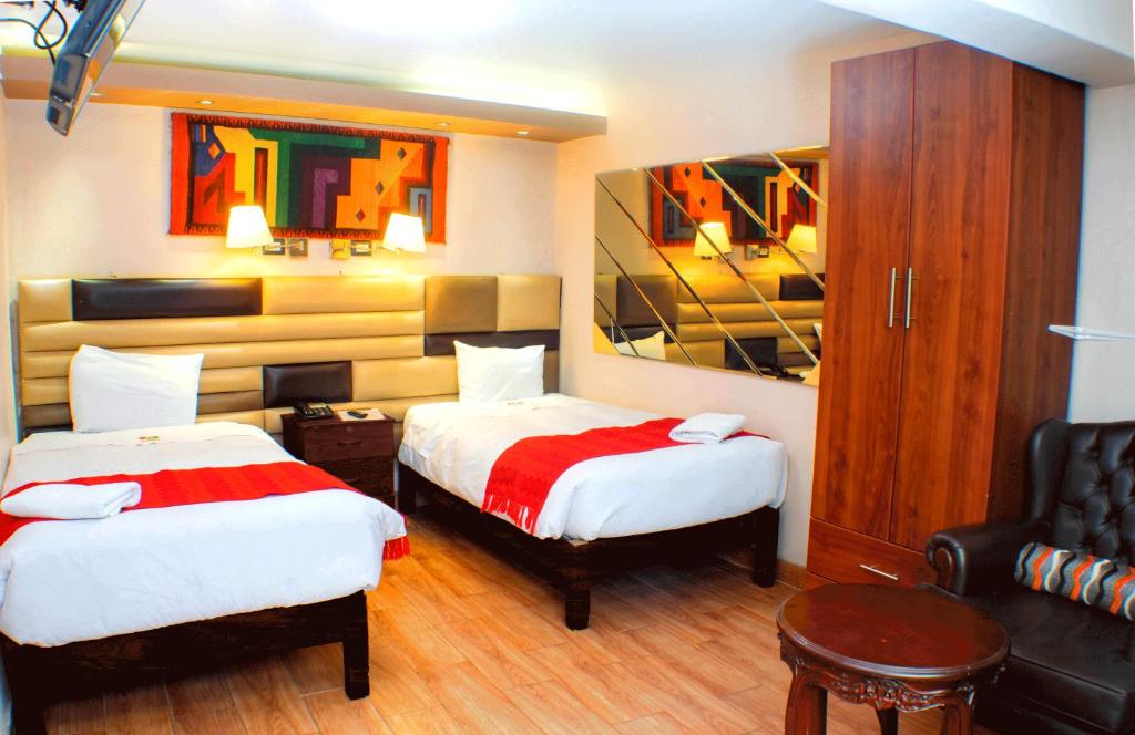 Letto o letti in una camera di Hotel Royal Qosqo