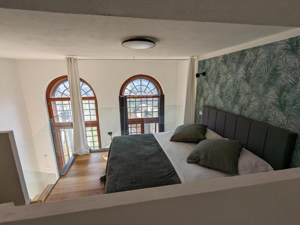 Posteľ alebo postele v izbe v ubytovaní mini loft Lido with own sunny & private garden