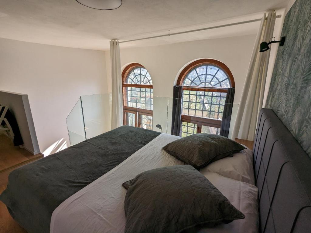 Posteľ alebo postele v izbe v ubytovaní mini loft Lido with own sunny & private garden