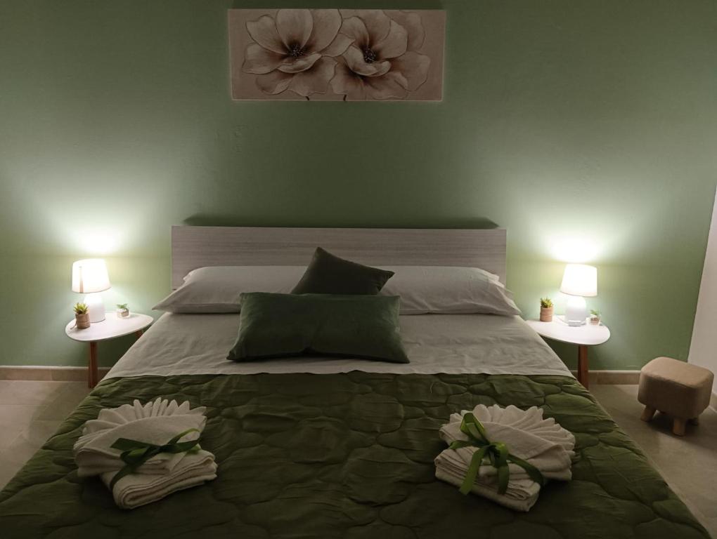 Postel nebo postele na pokoji v ubytování SiciliAmo b&b