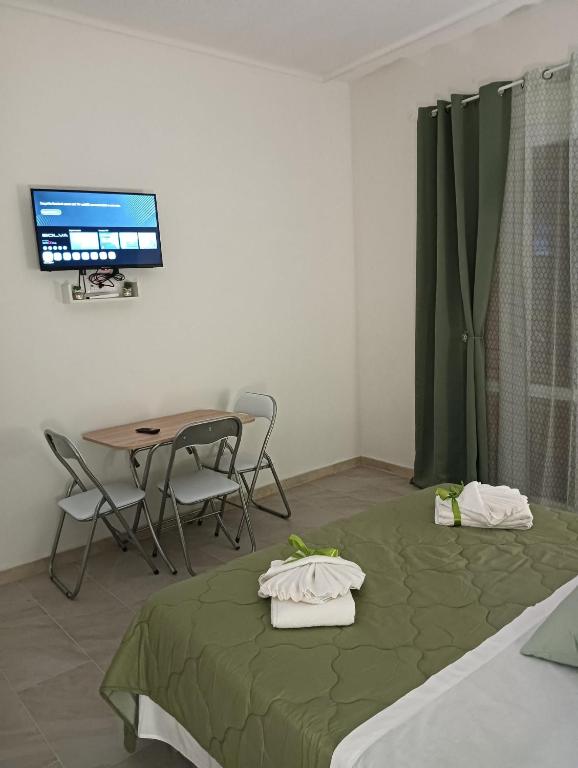 Postel nebo postele na pokoji v ubytování SiciliAmo b&b