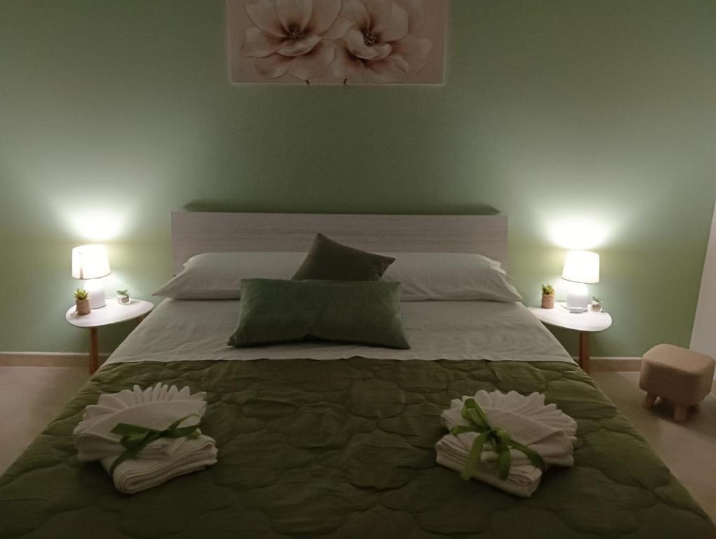 Postel nebo postele na pokoji v ubytování SiciliAmo b&b