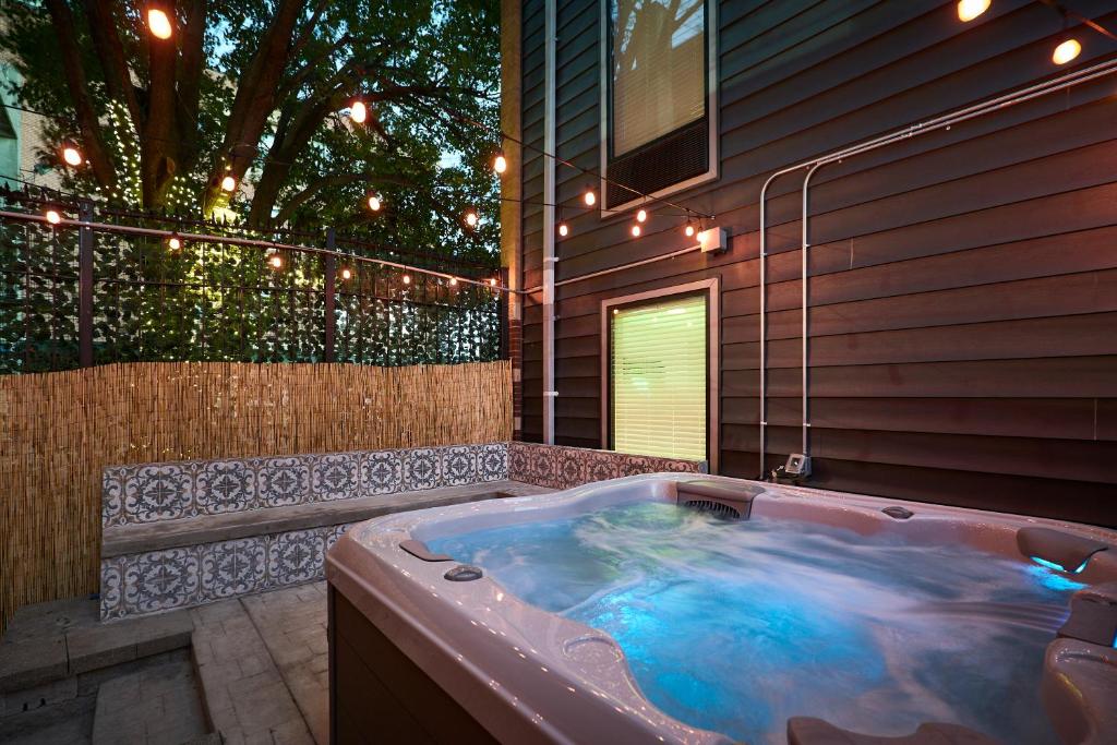 a jacuzzi tub in a house with lights at The West End in Tower Grove
