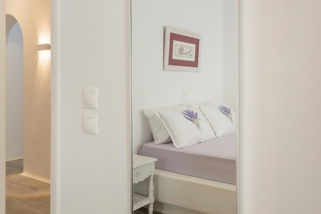 Postel nebo postele na pokoji v ubytování Paros Melodia Apartments