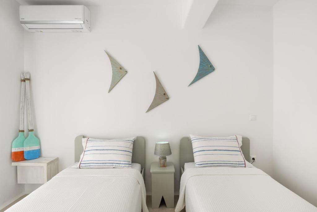 Postel nebo postele na pokoji v ubytování Paros Melodia Apartments