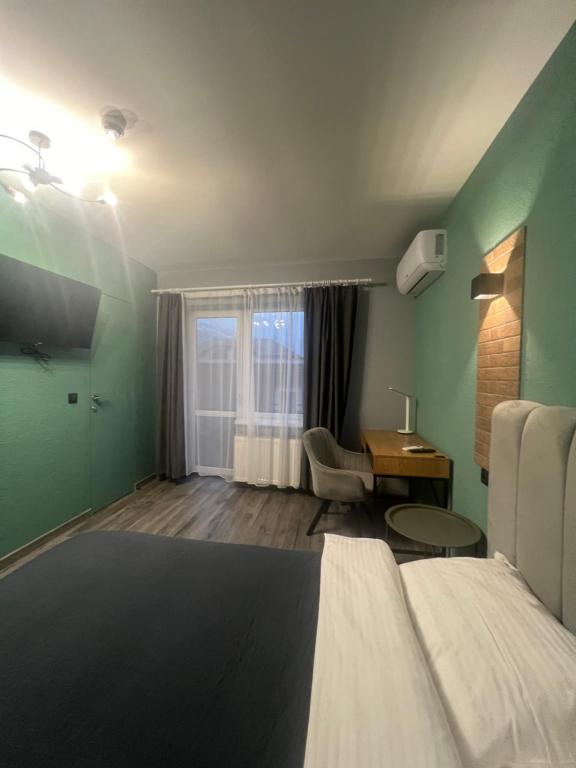 Postel nebo postele na pokoji v ubytování Hotel Menchul