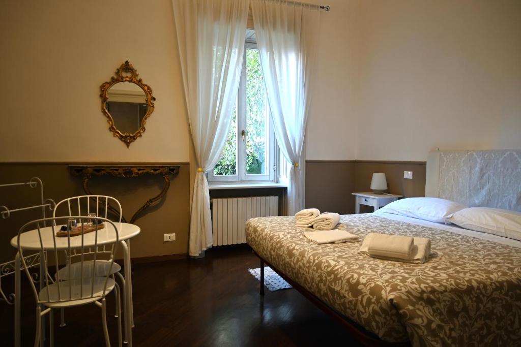 Postel nebo postele na pokoji v ubytování Dimora Montecchi