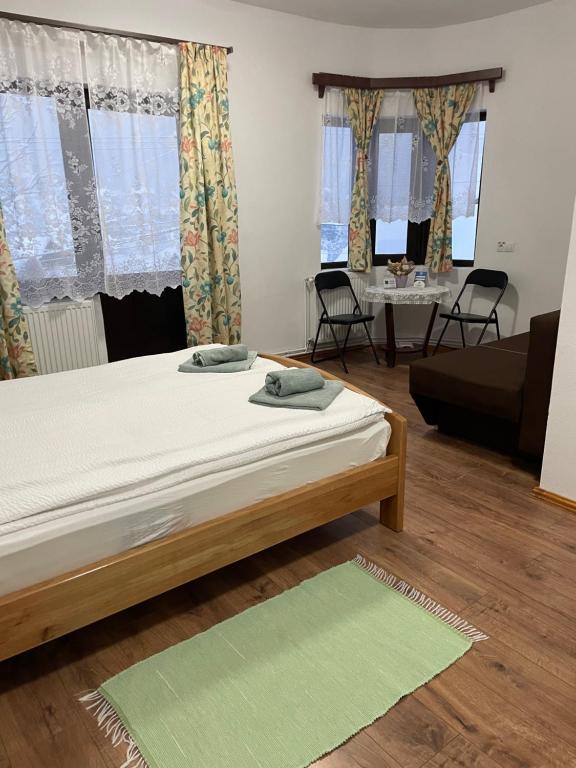 Postel nebo postele na pokoji v ubytování Casa Forrás