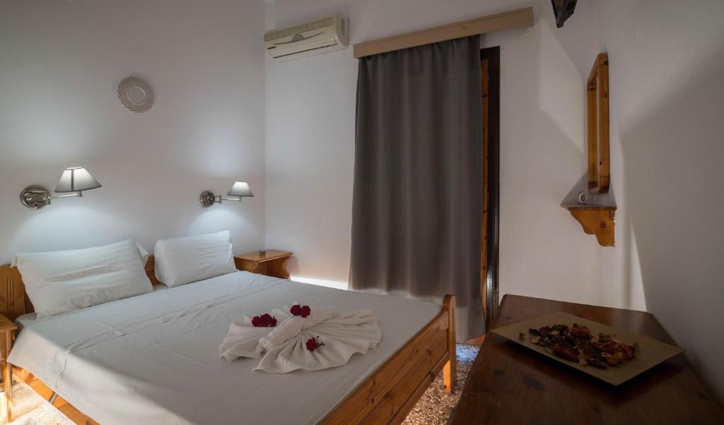 Postel nebo postele na pokoji v ubytování Minoa sea rooms