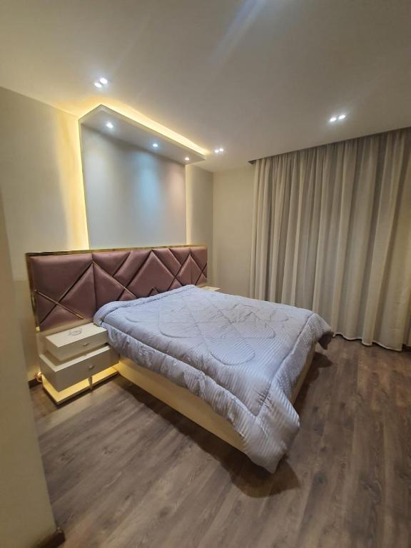 Postel nebo postele na pokoji v ubytování New Cairo rooms