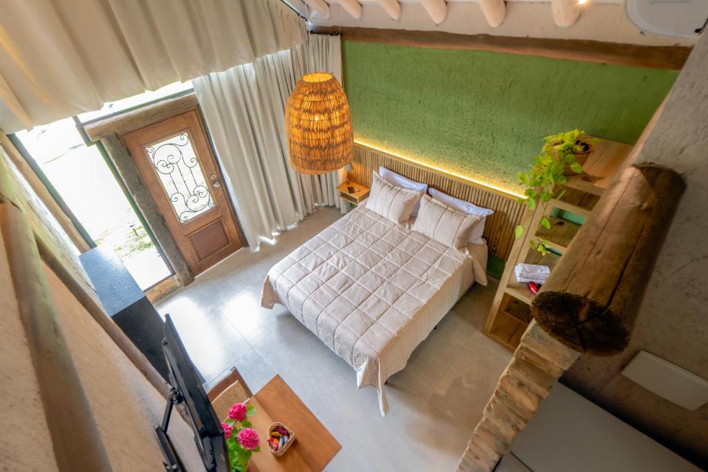 Ένα ή περισσότερα κρεβάτια σε δωμάτιο στο Pousada Villa Del More