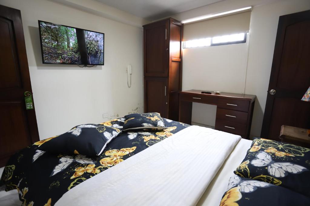 Postel nebo postele na pokoji v ubytování Hôtel d’lyon