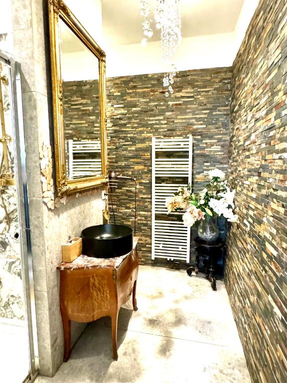 a bathroom with a sink and a mirror at Belvedere Apartment in Vienna