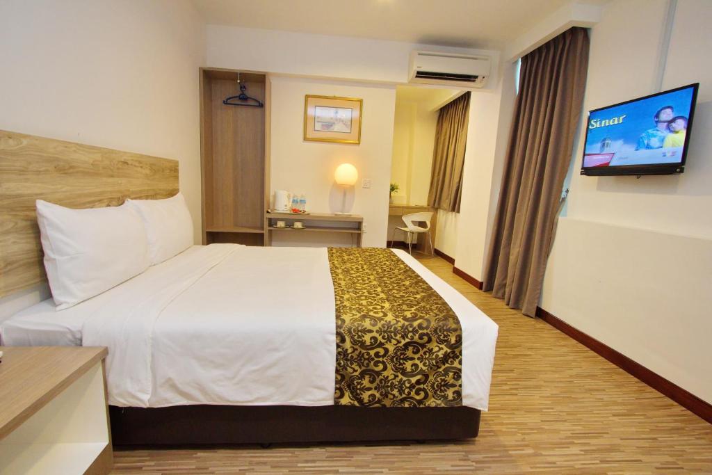 Postel nebo postele na pokoji v ubytování Molek Garden Hotel
