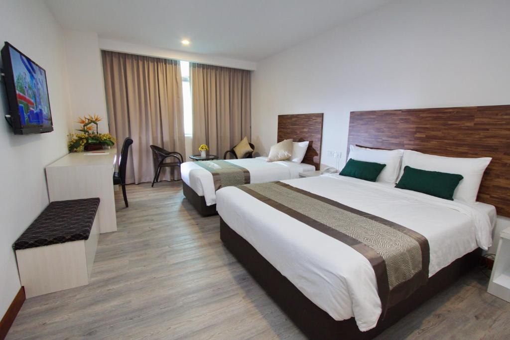 Postel nebo postele na pokoji v ubytování Molek Garden Hotel