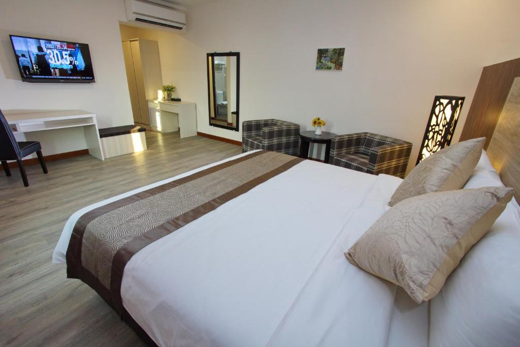 Postel nebo postele na pokoji v ubytování Molek Garden Hotel