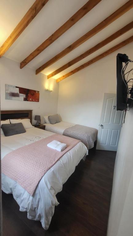 Letto o letti in una camera di Hostal Uruz