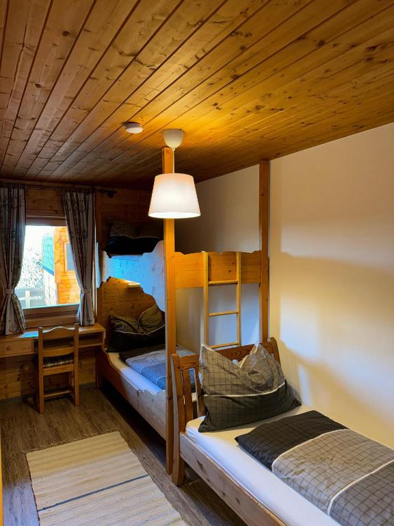 Postel nebo postele na pokoji v ubytování Bergzeit Klippitz