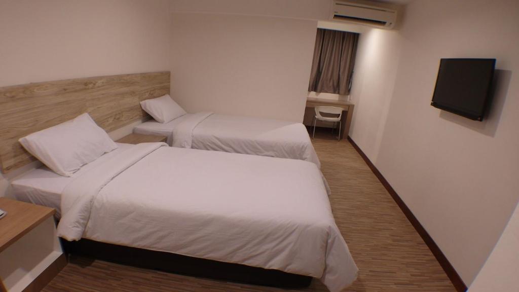 Postel nebo postele na pokoji v ubytování Molek Garden Hotel