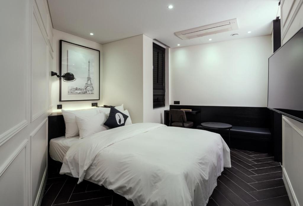Postel nebo postele na pokoji v ubytování Hotel The Designers Dongdaemun