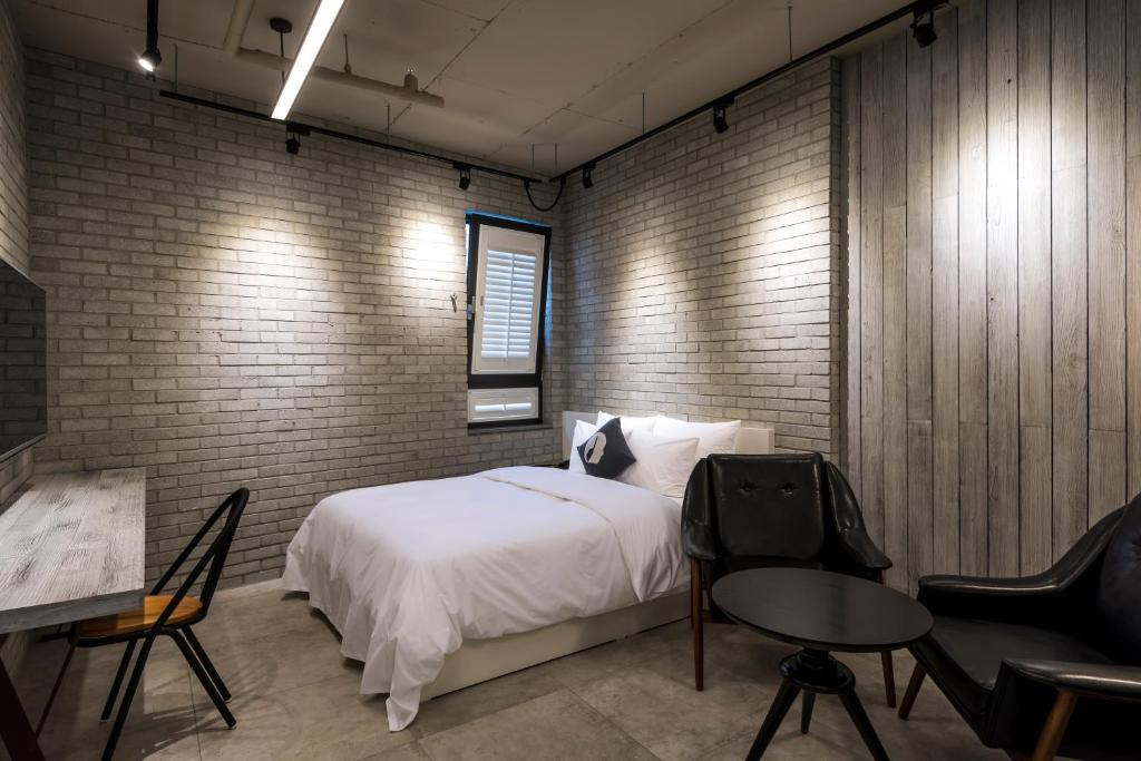 Postel nebo postele na pokoji v ubytování Hotel The Designers Dongdaemun