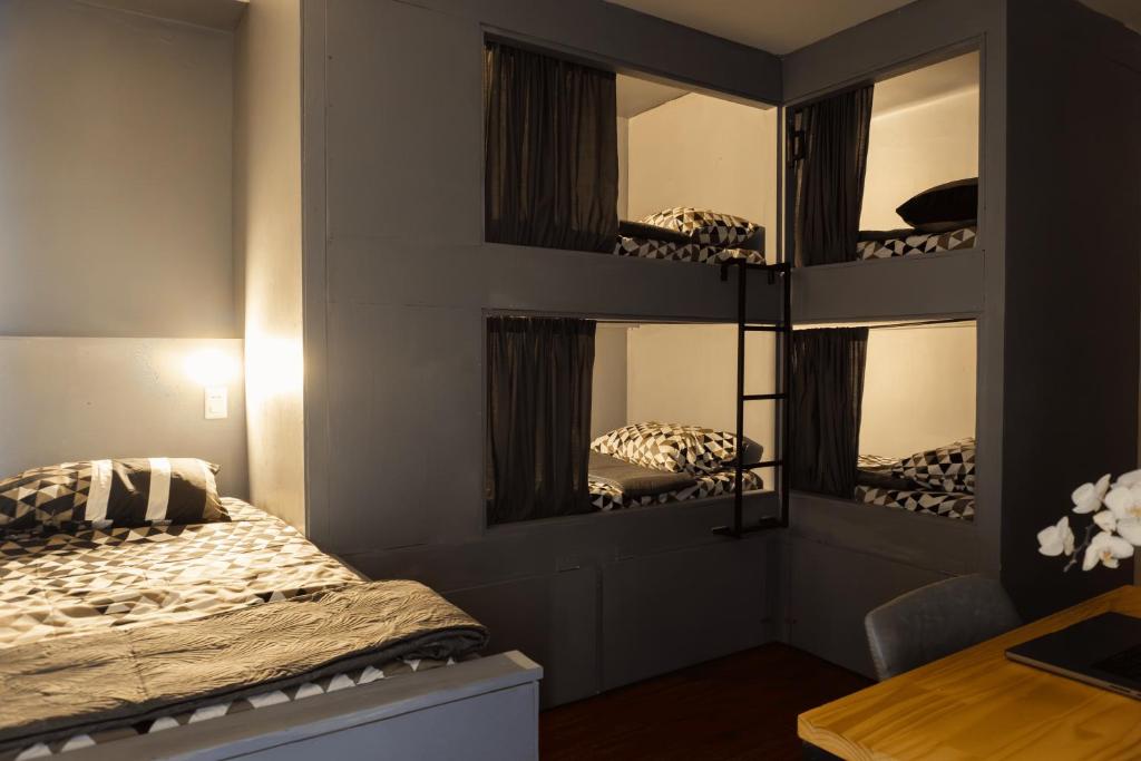 Voodi või voodid majutusasutuse Hostel La Moneda toas