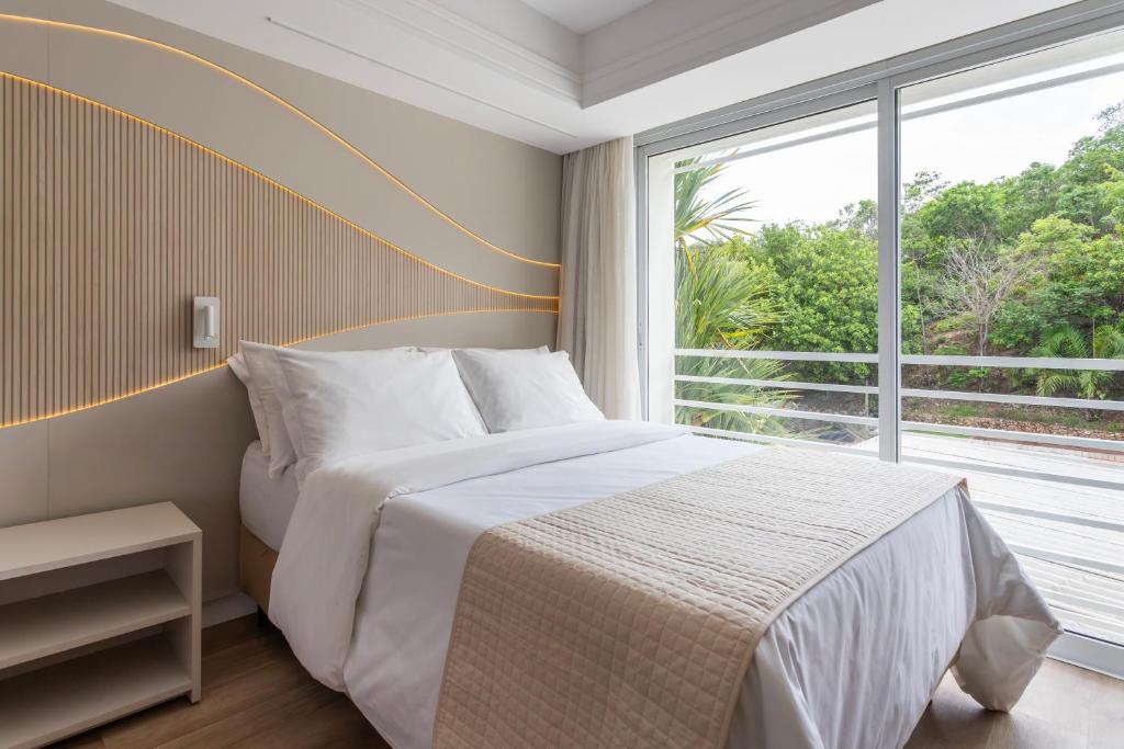 Postel nebo postele na pokoji v ubytování Rio Quente Resorts - Hotel Turismo